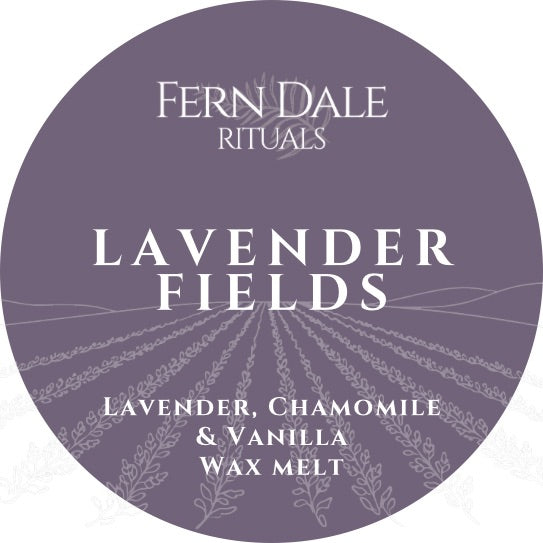 Lavender Fields round purple wax melt label with white lettering and an illustration of lavender rows.